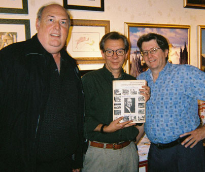 Sam Calvin and a Harryhausen fan and Ernest Farino pose with a copy of the first edition of their magazine FXRH. 
